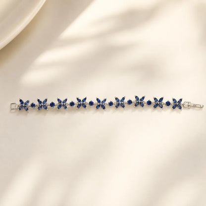 Blue floral gemstone bracelet shown flat in a full-length view