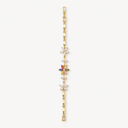 Gold bracelet with multicolor and clear crystal flowers shown flat