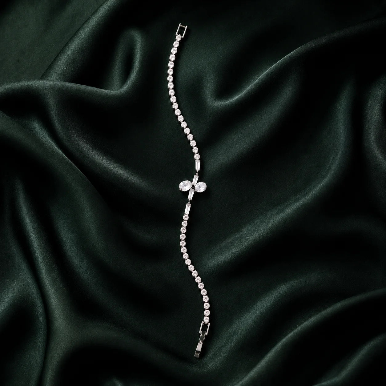 Silver crystal bracelet with bow detail in a full product view