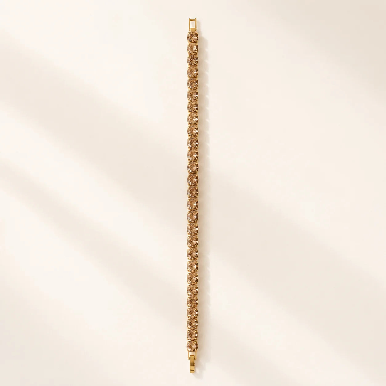 Textured gold chain bracelet shown flat in a full-length view