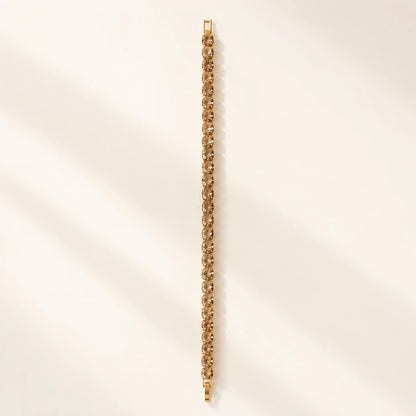 Textured gold chain bracelet shown flat in a full-length view