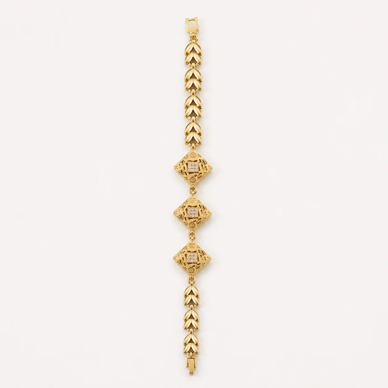 Gold bracelet with three geometric diamond-shaped centerpieces
