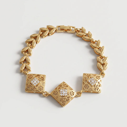 Chunky gold bracelet with three engraved geometric centerpieces