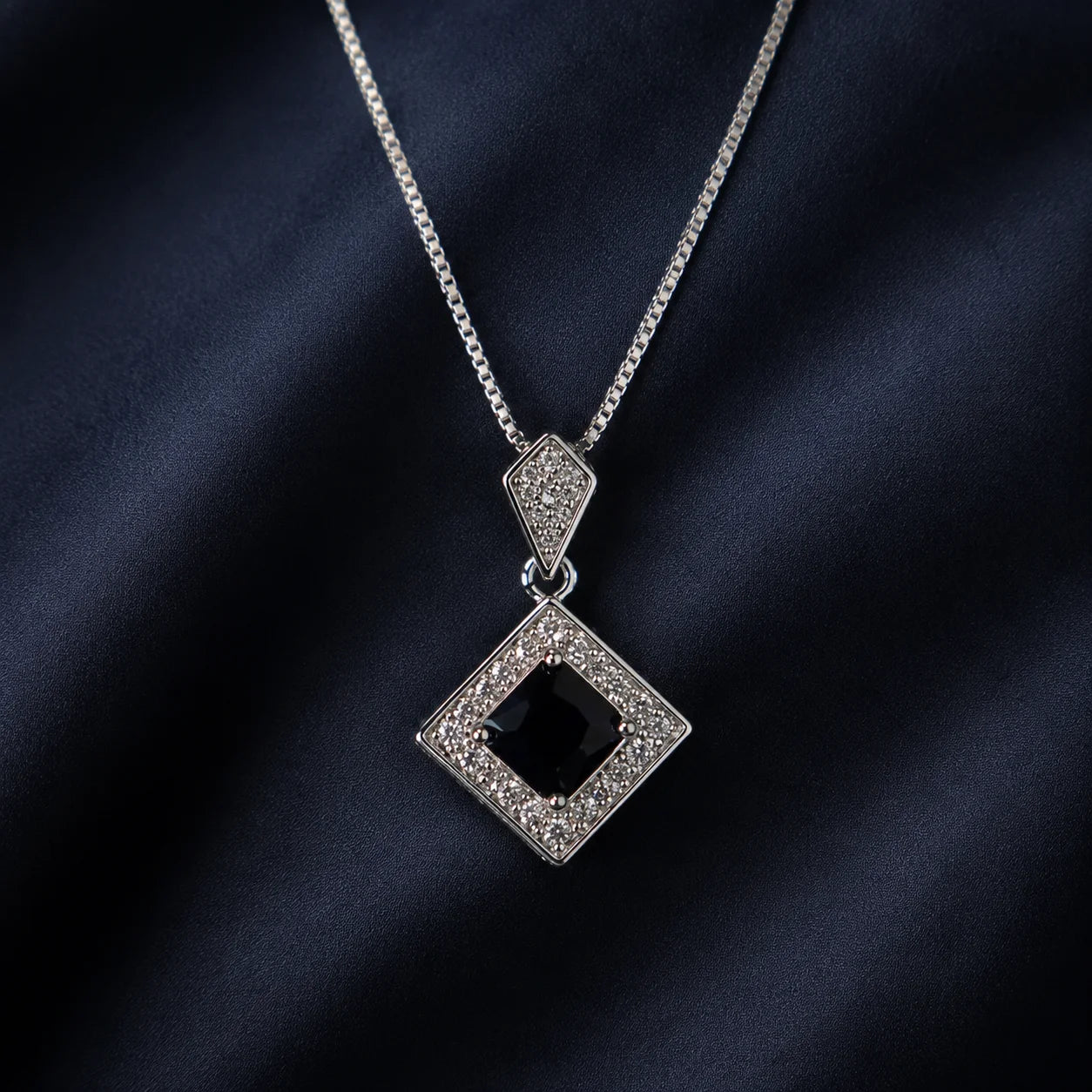 Silver necklace with black square crystal pendant close-up