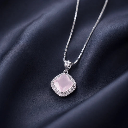 Silver necklace with pink square crystal pendant close-up