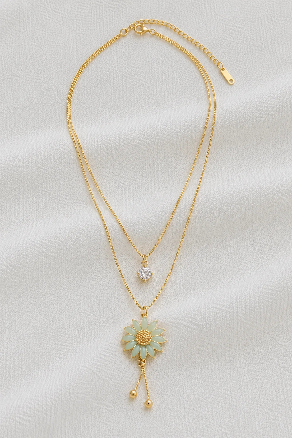 Layered gold necklace with mint flower pendant full product view