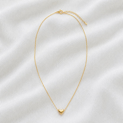 Delicate gold necklace with small heart pendant full product view