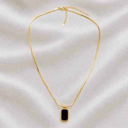Gold snake-chain necklace with black rectangular pendant full product view