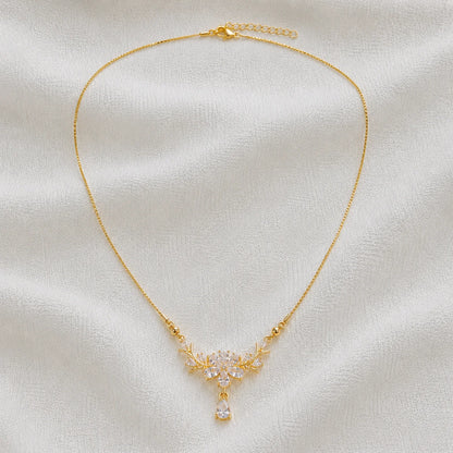 Delicate gold necklace with crystal floral pendant full product view