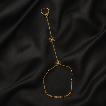 Gold three-flower hand chain shown flat in a full product view